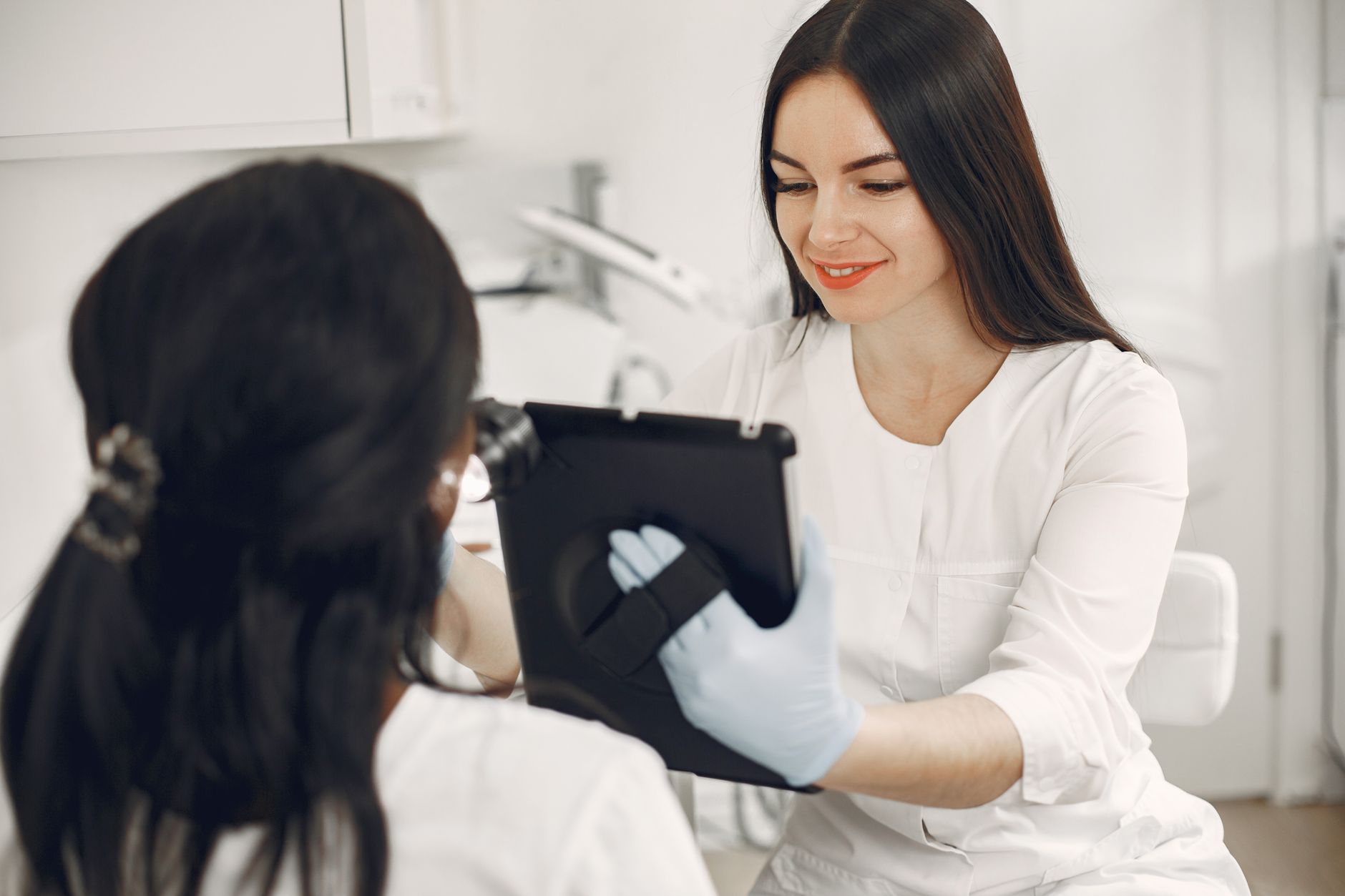 A clinician with a patient